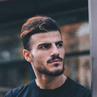 Man with dark styled hair