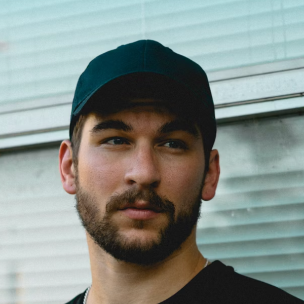 Man wearing black cap outdoors